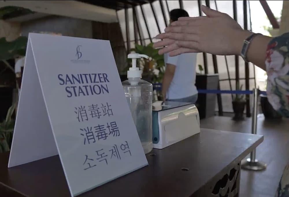 The Bellevue Resort Panglao Exterior foto A hand sanitizer station at a hotel in Seoul, South Korea